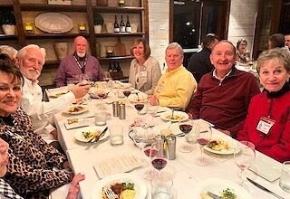 Brothers and guests enjoying one of the 3 courses with wine pairings